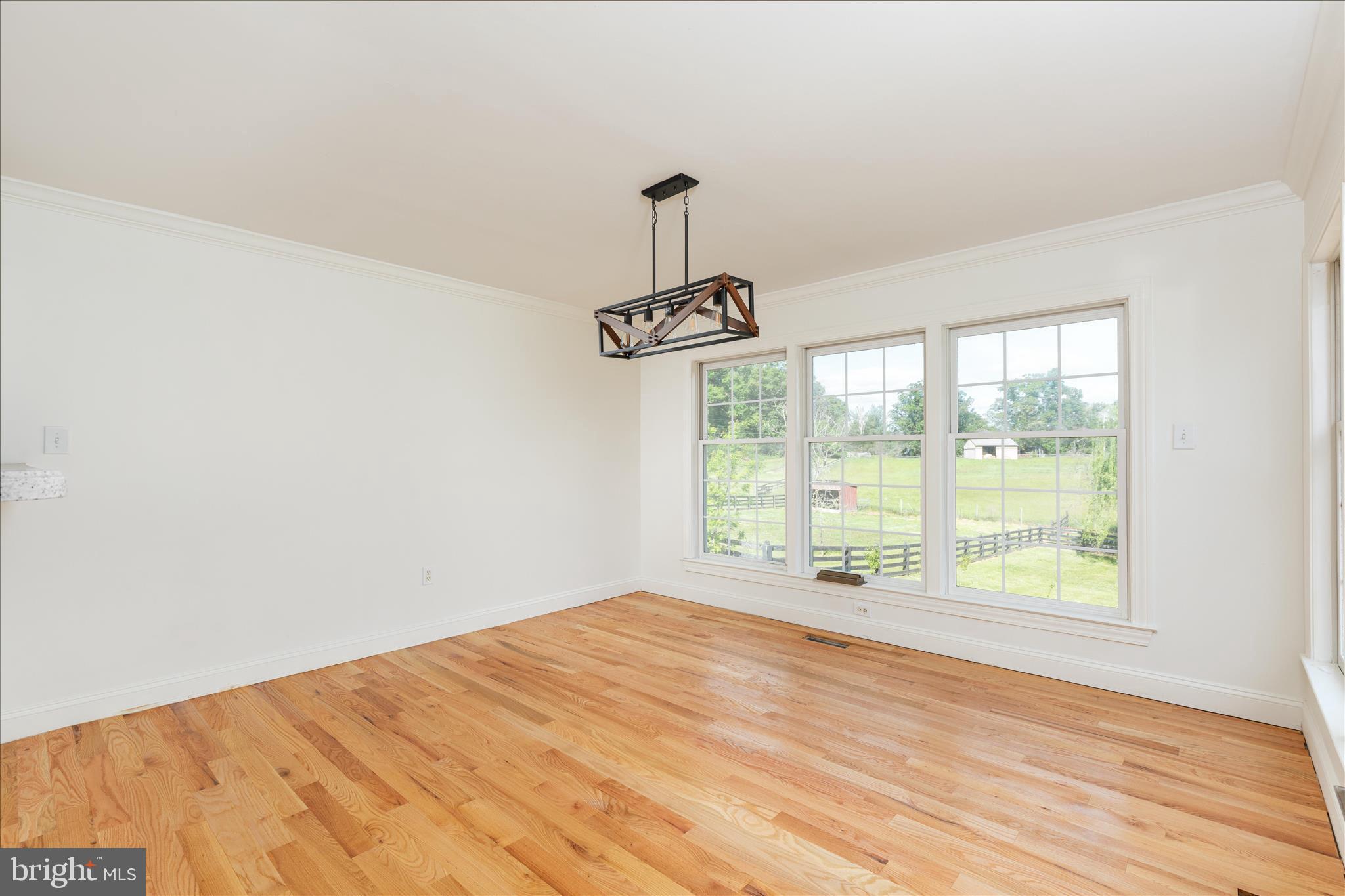 1200 Salem Church Road Stephens City, VA 22655 - Photo 14 of 69 a view of an empty room with wooden floor and a window