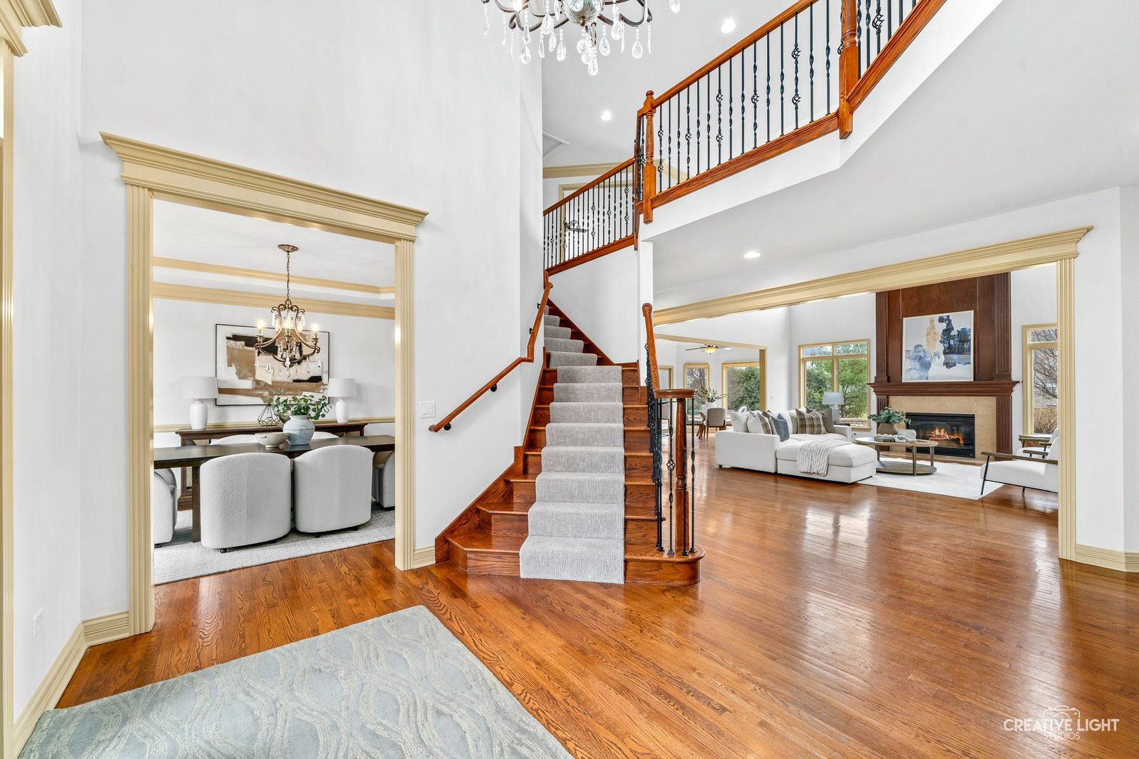 1887 Snead Street Bolingbrook, IL 60490 - Photo 5 of 49 a dining room with wooden floor and stairs