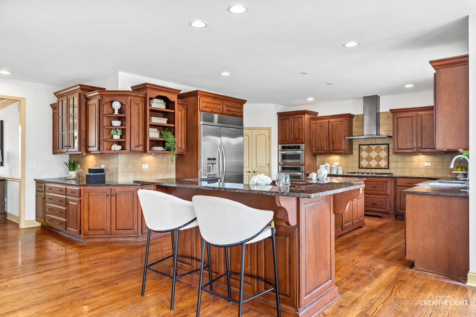 1887 Snead Street Bolingbrook, IL 60490 - Photo 9 of 49 a kitchen with a table chairs microwave and cabinets