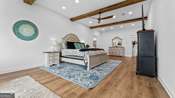 a view of a backyard with table and chairs a fire pit and two lawn chairs