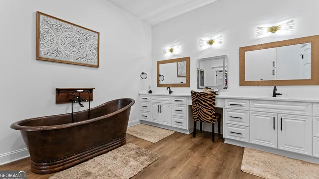 a backyard of a house with lots of green space and seating area