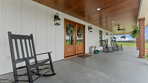 a view of a back yard of the house and green space