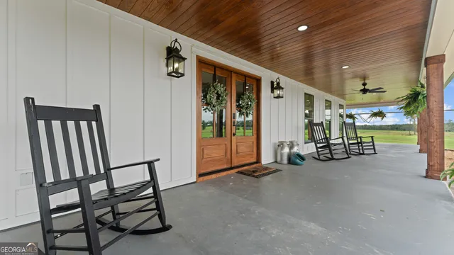 a view of a back yard of the house and green space
