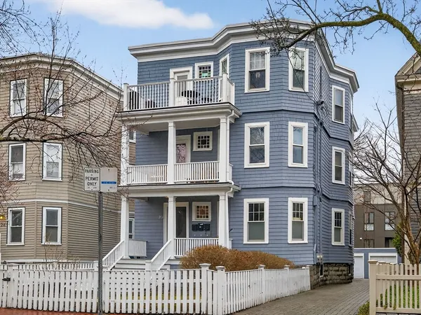 a view of a brick building with many windows