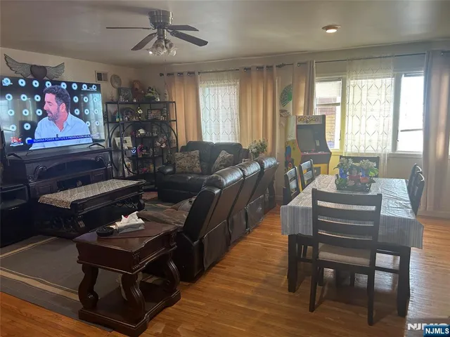a living room with furniture a rug and a window