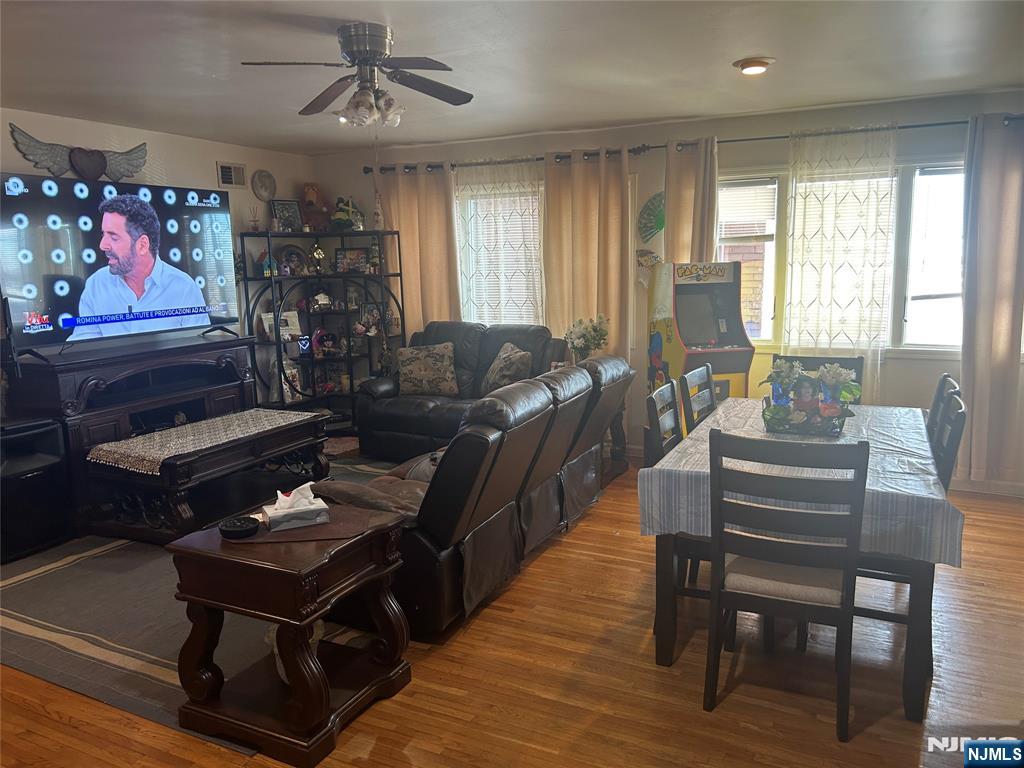 382 Lakeview Avenue, Unit 1 Clifton, NJ 07011 - Photo 4 of 13 a living room with furniture a rug and a window