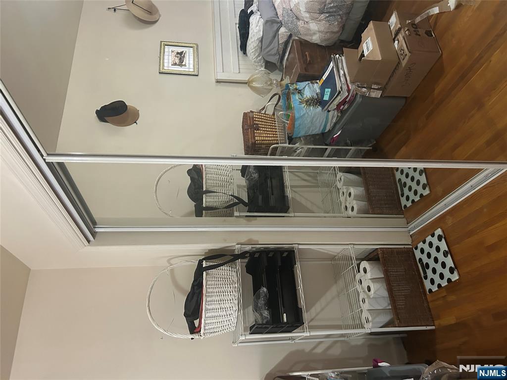 382 Lakeview Avenue, Unit 1 Clifton, NJ 07011 - Photo 9 of 13 a bedroom with furniture and a window