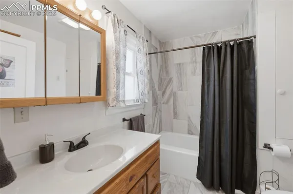 a bathroom with a sink and a tub