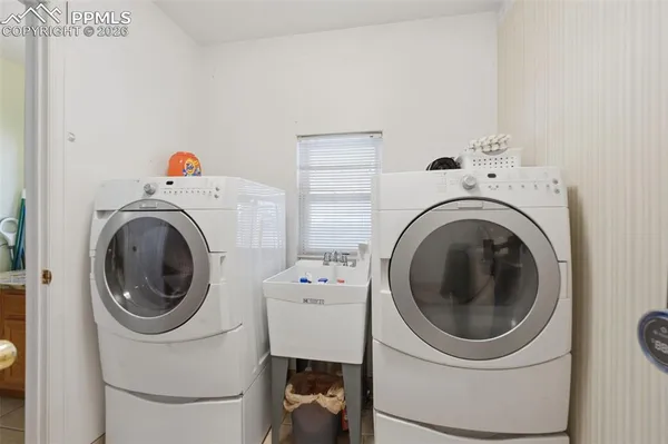 a utility room with dryer and washer