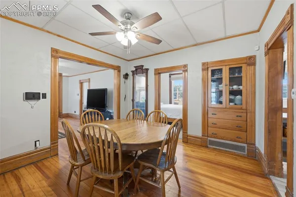 a view of a dining room with furniture window and wooden floor
