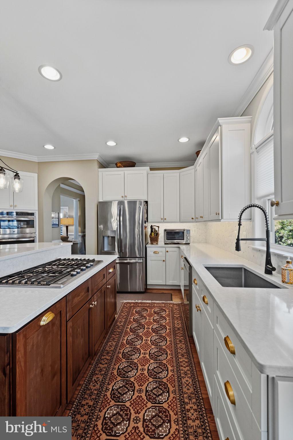 2656 Brook Valley Road Frederick, MD 21701 - Photo 26 of 89 a kitchen with stainless steel appliances granite countertop a stove a sink and a refrigerator