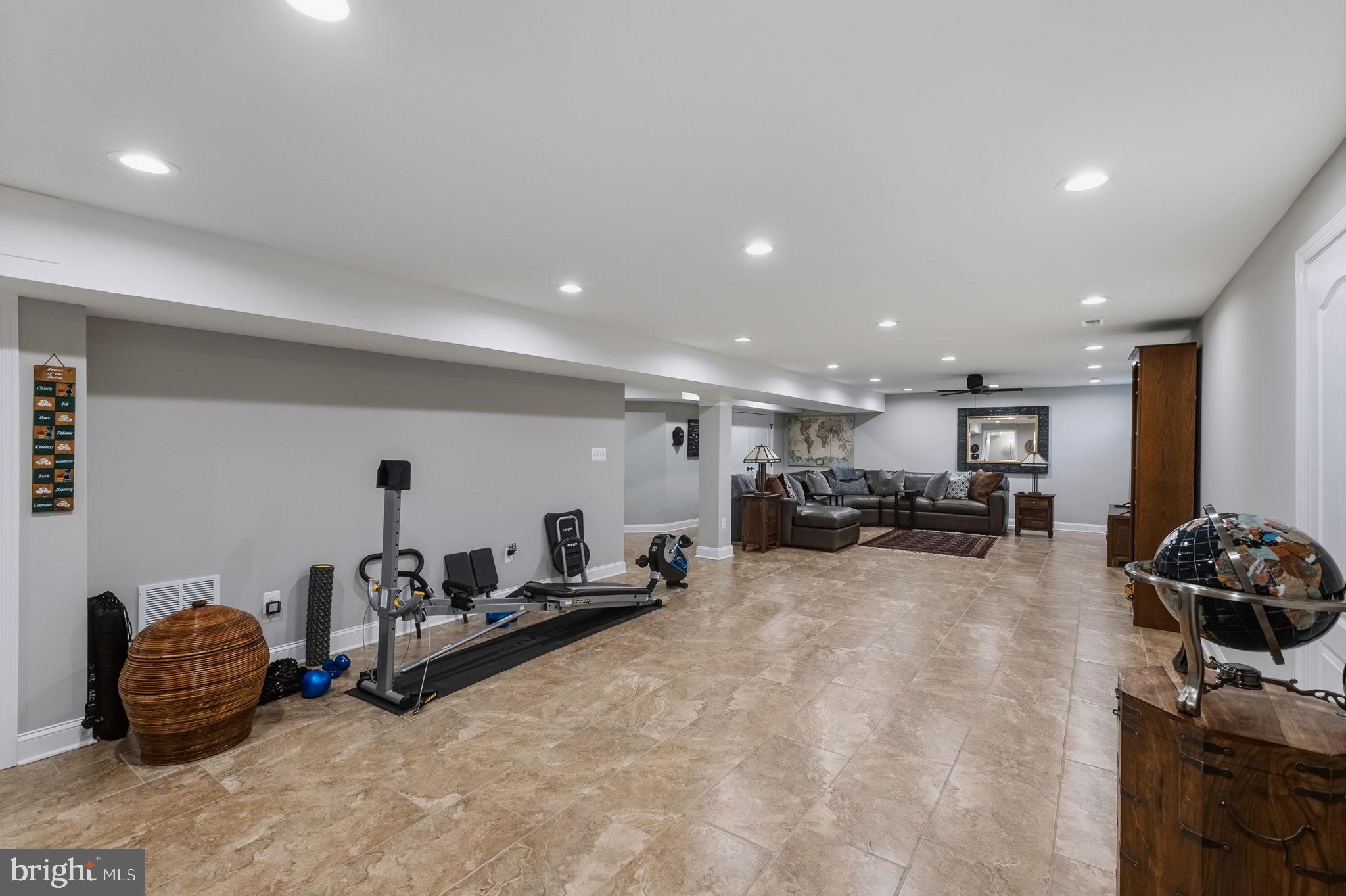 2656 Brook Valley Road Frederick, MD 21701 - Photo 73 of 89 a room with gym equipment and a flat screen tv