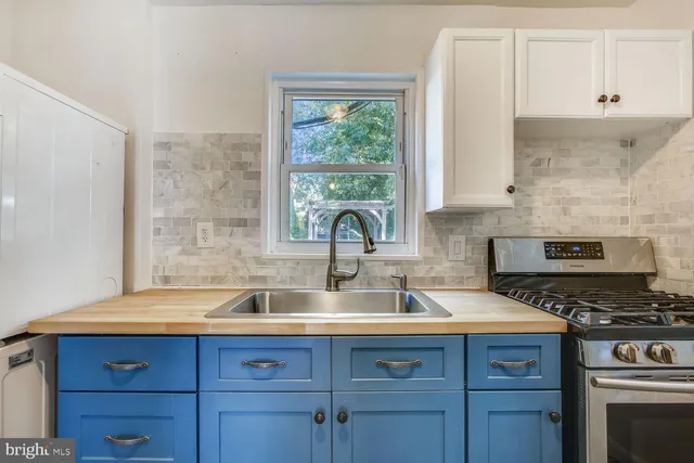 a kitchen with a sink and a stove
