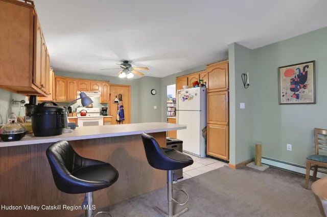 a spacious bedroom with a bed and a chandelier