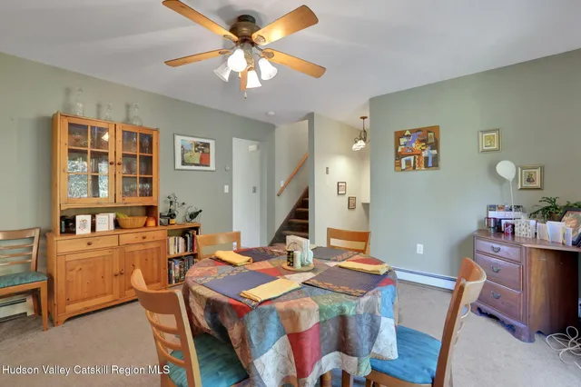 a bedroom with two beds and a window