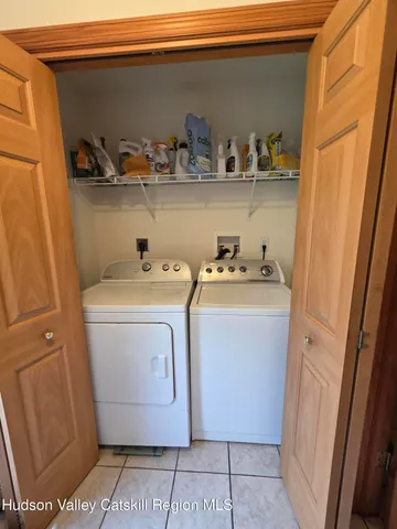 a bedroom with a large bed and a large window