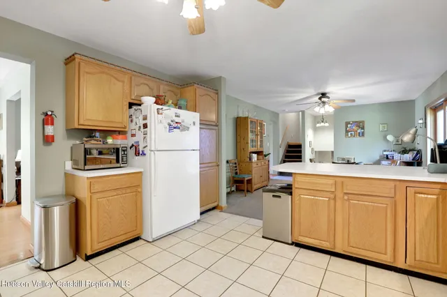 a utility room with cabinets washer and dryer