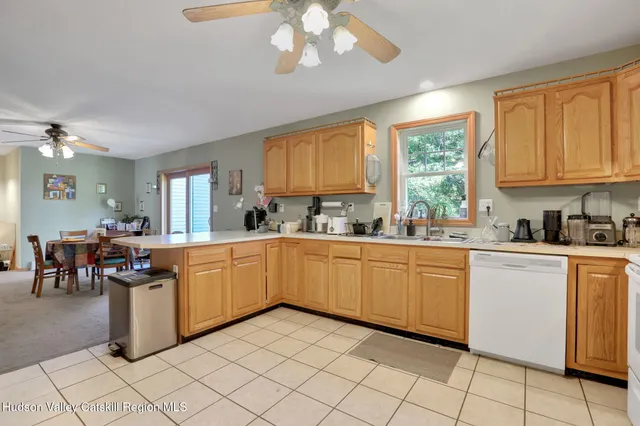 a view of a dining room with furniture wooden floor and chandelier