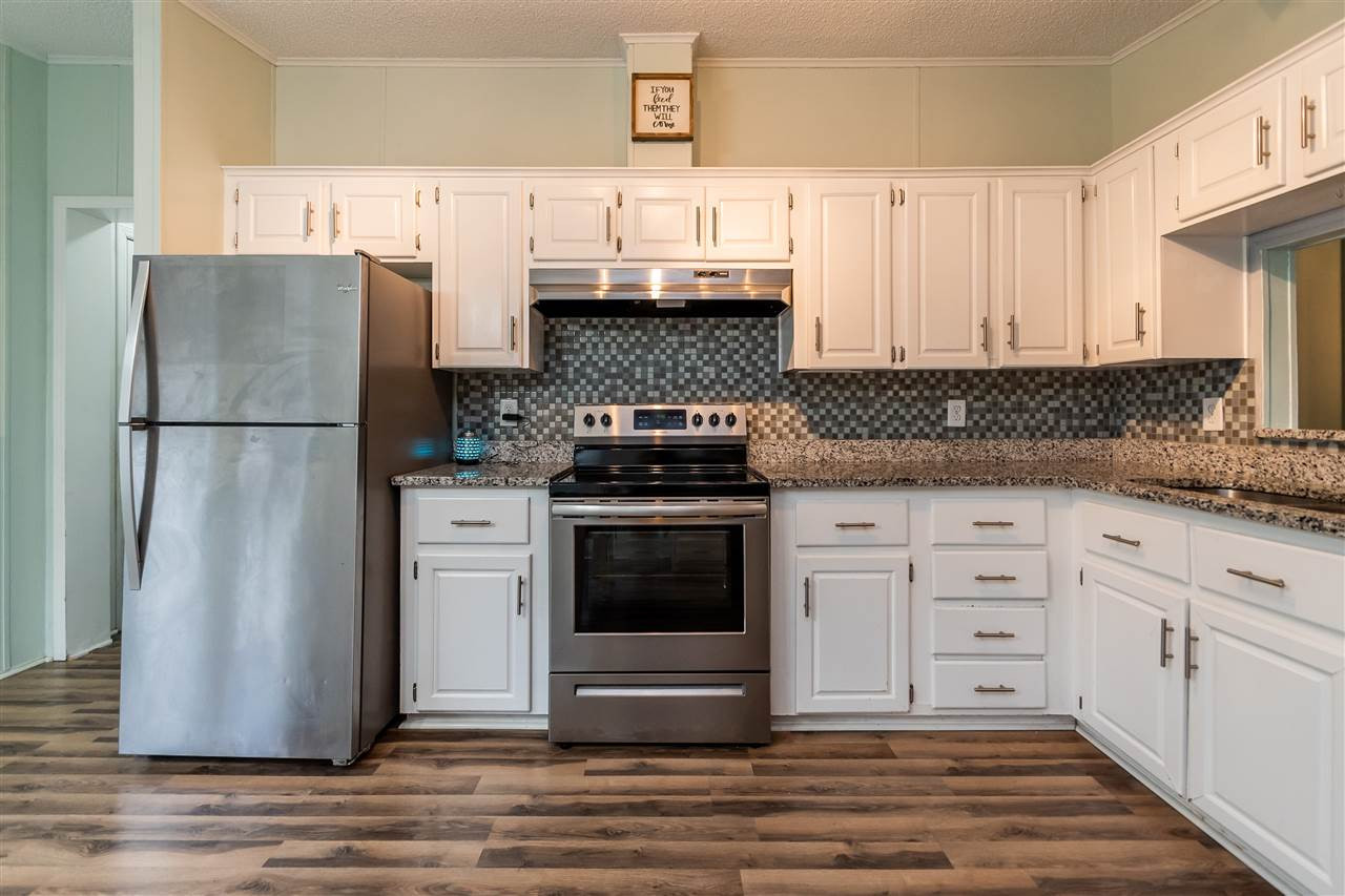 8409 Creek Road Willow Spring, NC 27592 - Photo 11 of 27 Tile backsplash & granite counters!