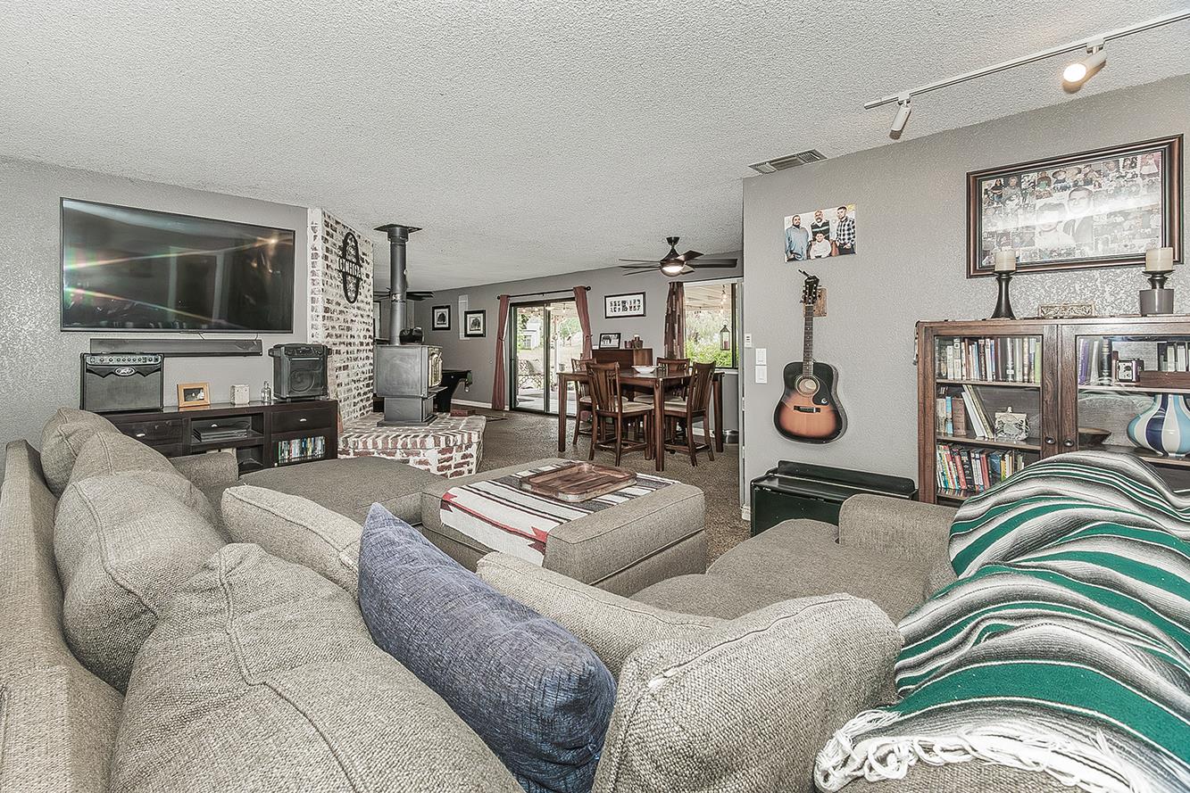 29545 Oak Meadow Road Tollhouse, CA 93667 - Photo 14 of 69 a living room with furniture and a flat screen tv