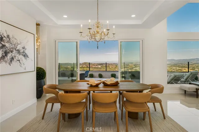 a living room with furniture and a view of kitchen
