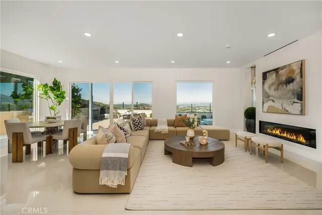 a kitchen with a sink a stove and chairs