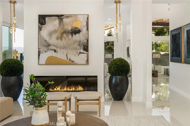 a kitchen with a sink and a stove with wooden floor