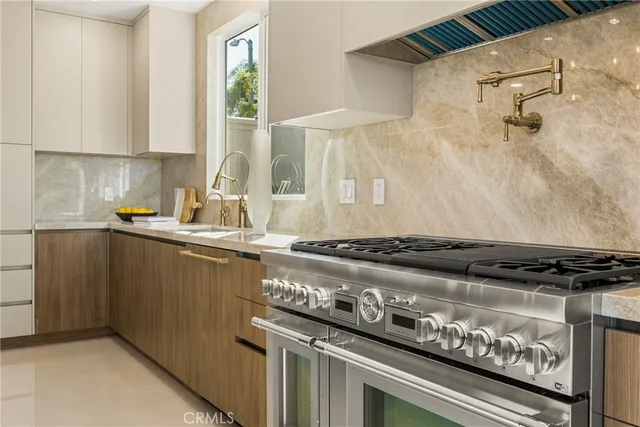 a bathroom with a granite countertop toilet sink and mirror