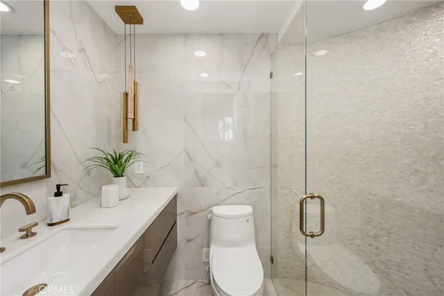 a bedroom with bed and a large mirror