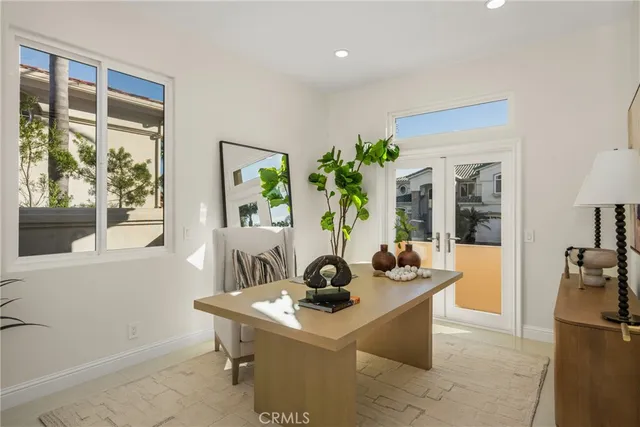 a bathroom with a sink toilet double vanity and shower