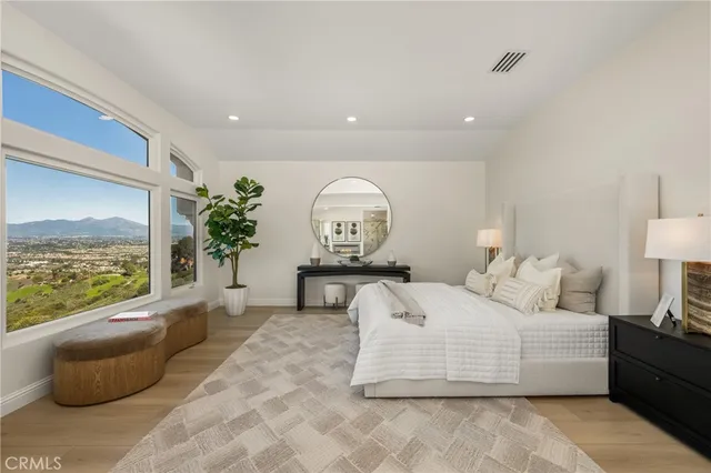 a bedroom with a bed and a night stand