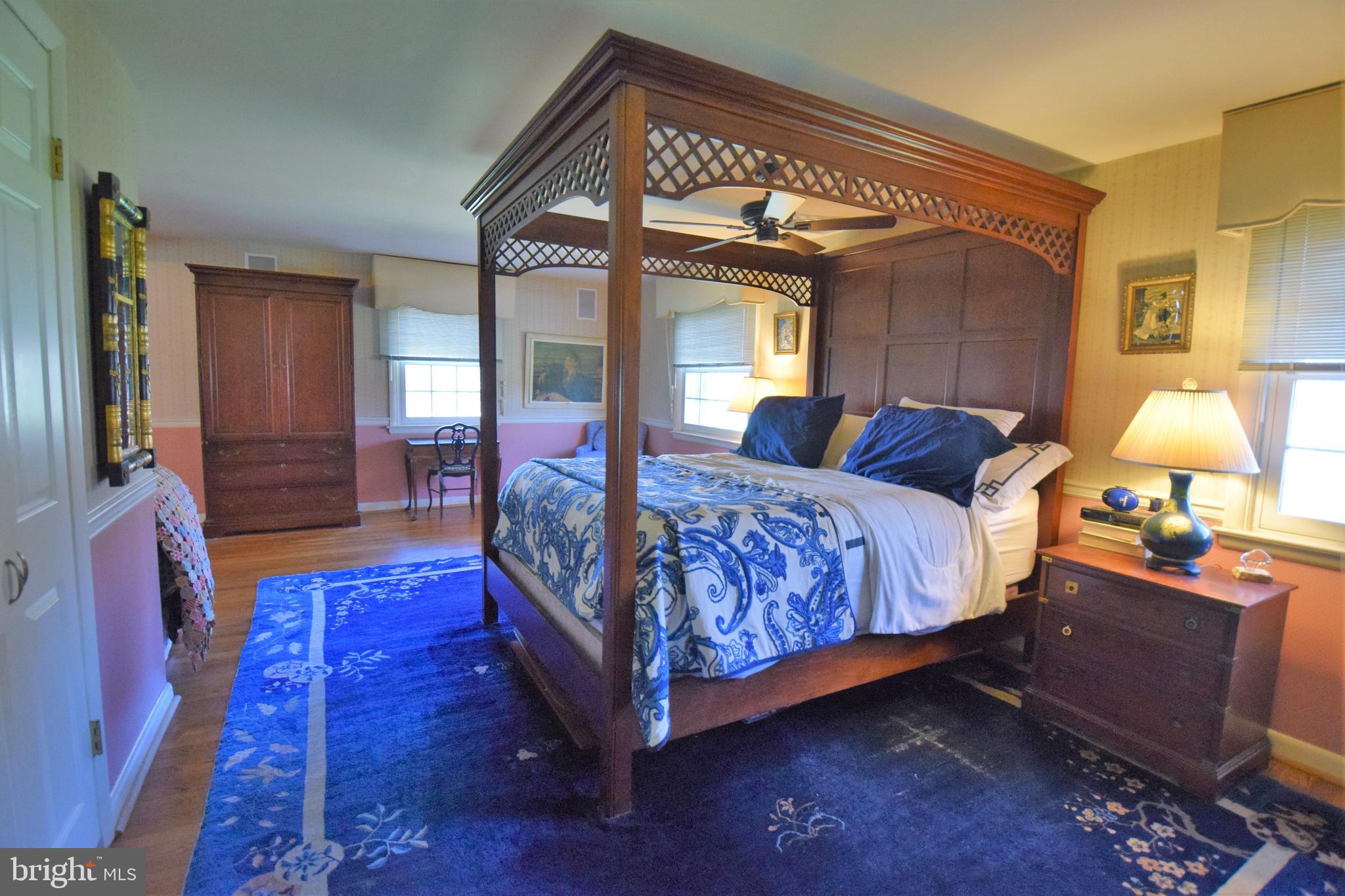 1550 Glenhardie Road Wayne, PA 19087 - Photo 13 of 38 a bedroom with bed and wooden floor
