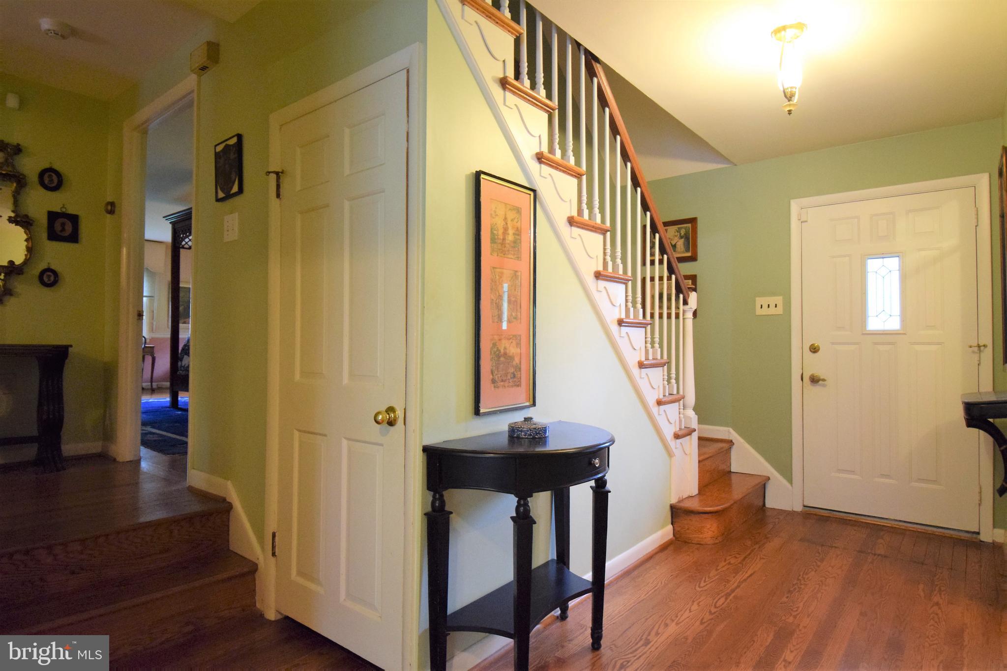 1550 Glenhardie Road Wayne, PA 19087 - Photo 18 of 38 a view of a hallway with wooden floor and staircase