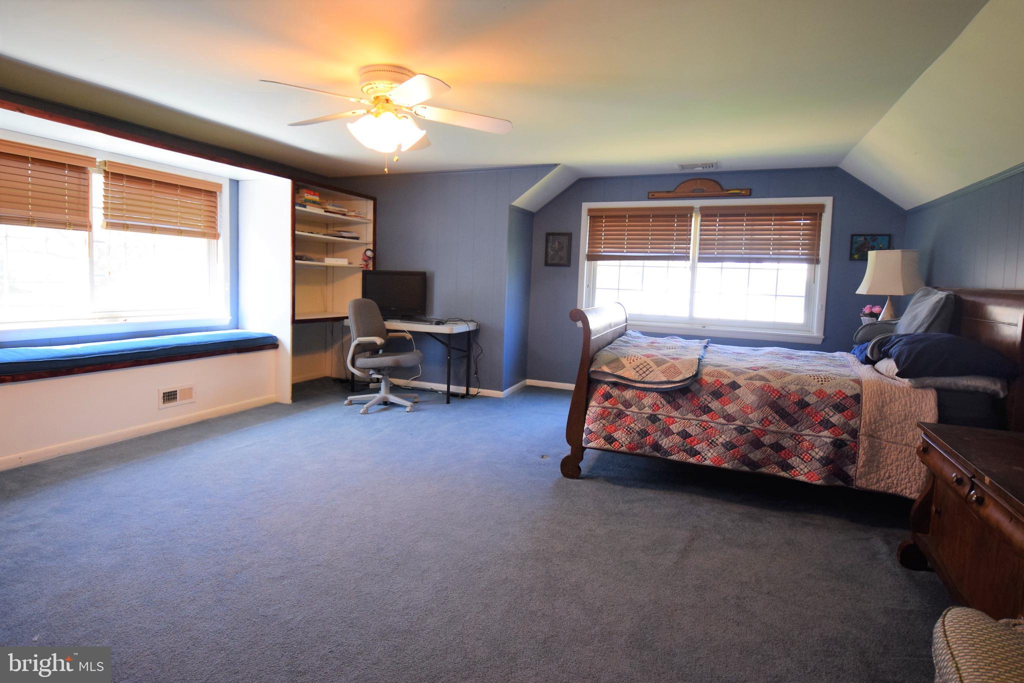 1550 Glenhardie Road Wayne, PA 19087 - Photo 21 of 38 a bedroom with bed and window