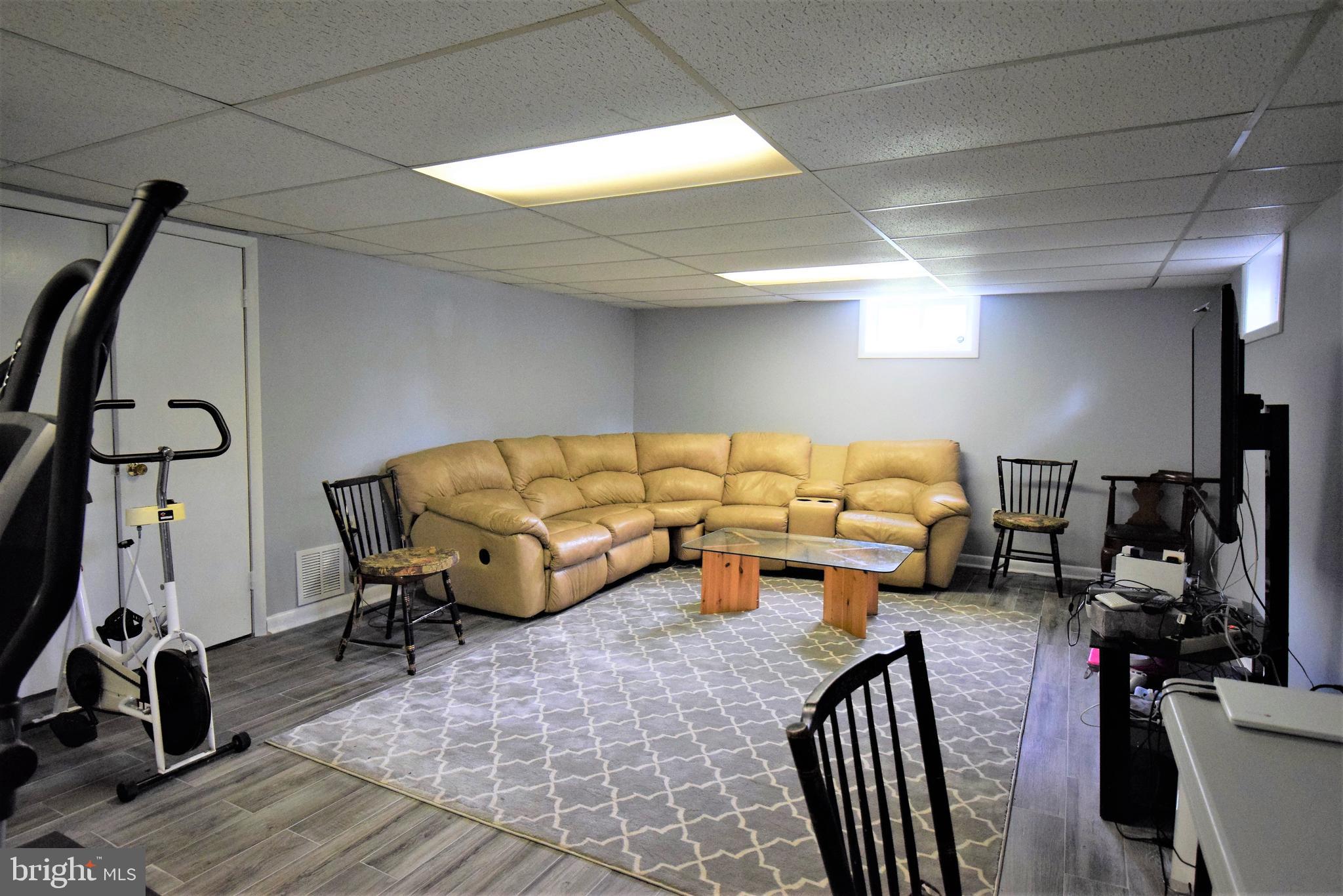 1550 Glenhardie Road Wayne, PA 19087 - Photo 24 of 38 a living room with furniture and gym equipment