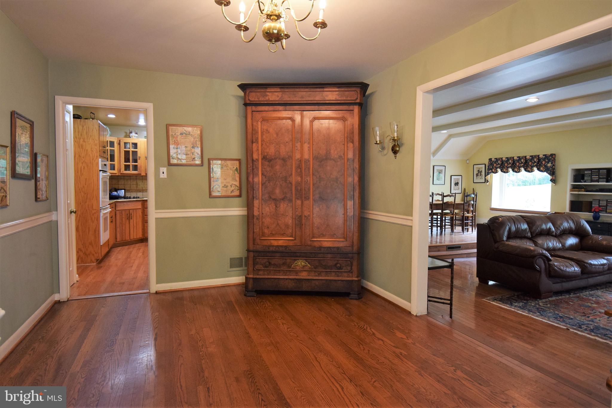 1550 Glenhardie Road Wayne, PA 19087 - Photo 4 of 38 a view of a livingroom with wooden floor and a ceiling fan