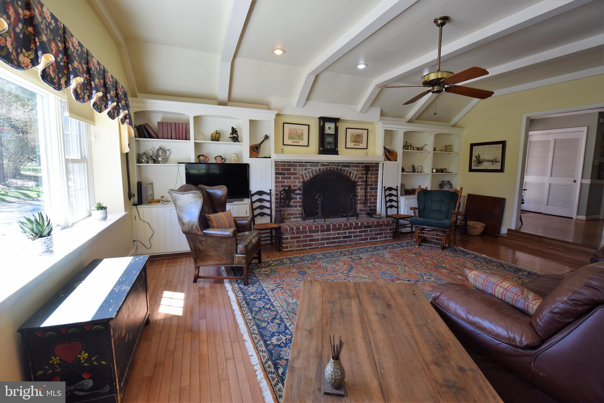 1550 Glenhardie Road Wayne, PA 19087 - Photo 33 of 38 a living room with furniture and a fireplace