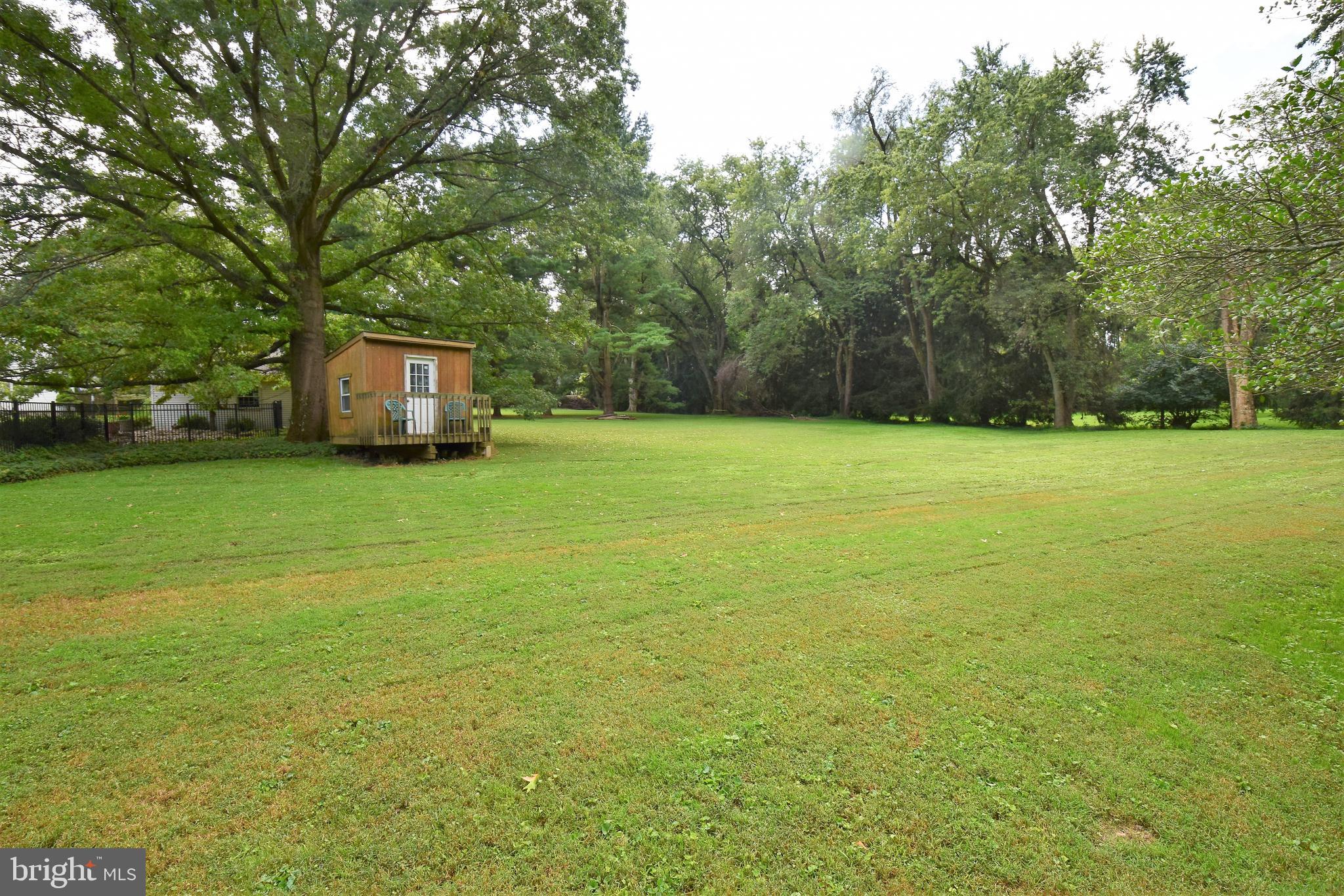 1550 Glenhardie Road Wayne, PA 19087 - Photo 37 of 38 a view of a big yard with a trees