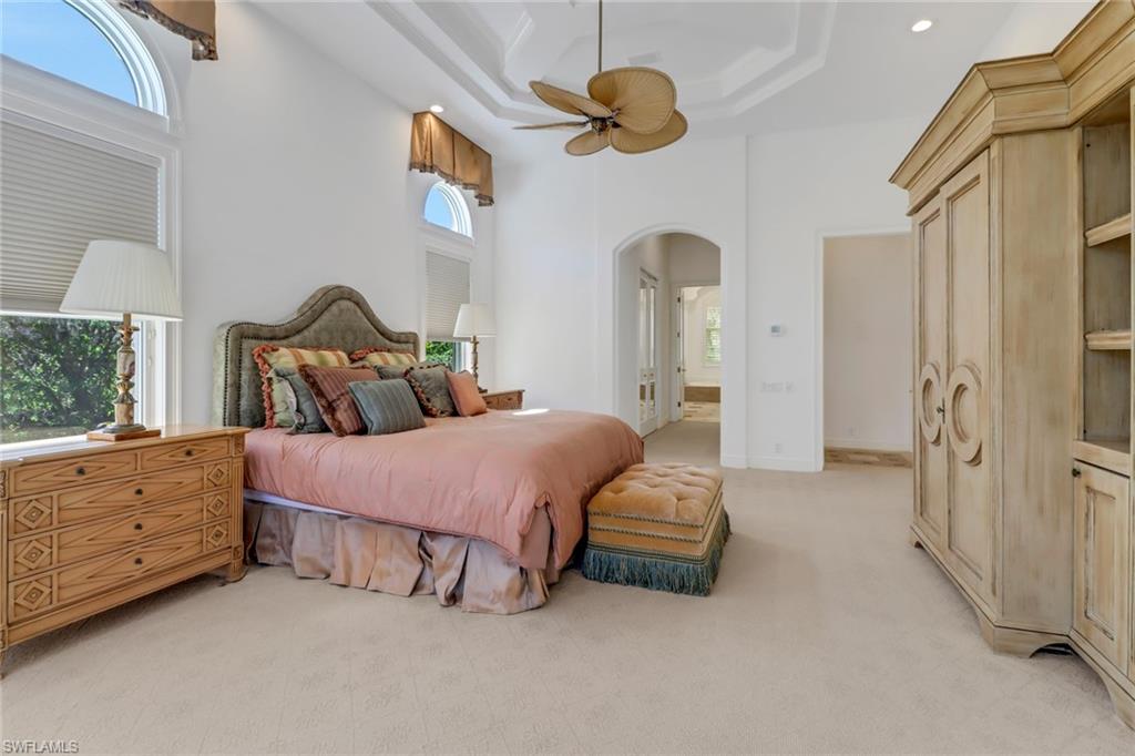 9376 Sweetgrass Way Naples, FL 34108 - Photo 20 of 49 a bedroom with a bed and a window