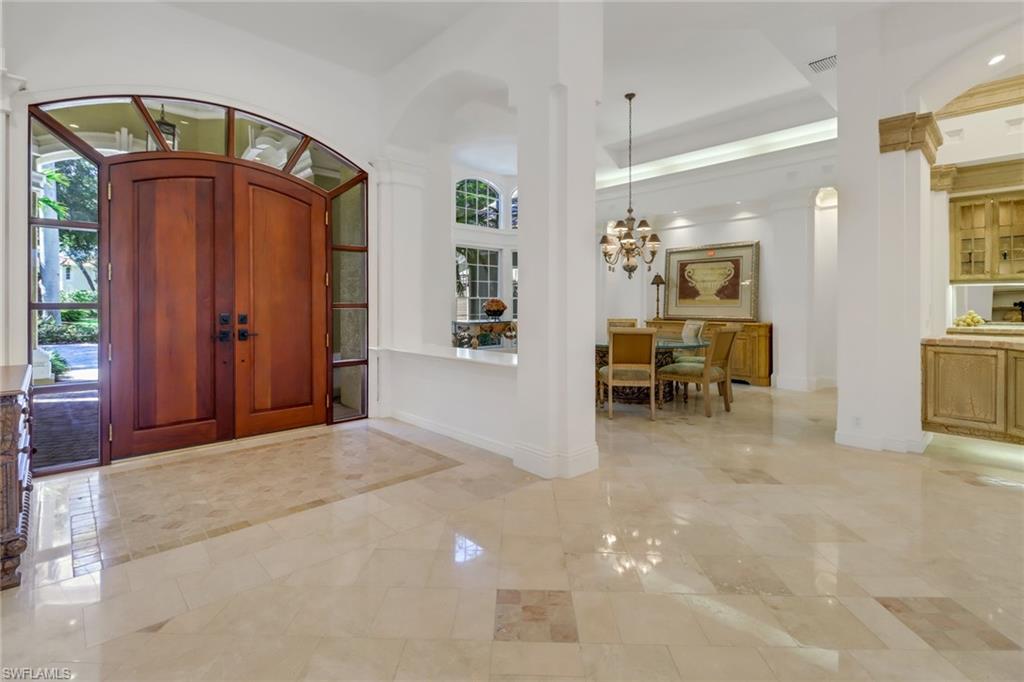 9376 Sweetgrass Way Naples, FL 34108 - Photo 2 of 49 a view of livingroom with furniture and chandelier fan