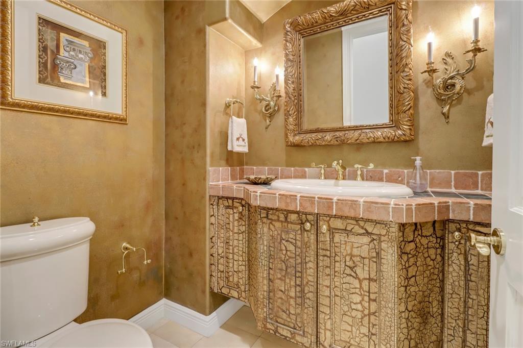 9376 Sweetgrass Way Naples, FL 34108 - Photo 28 of 49 a bathroom with a sink and a toilet