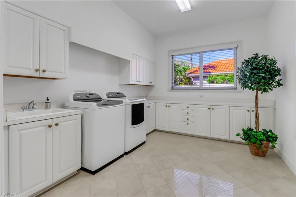 9376 Sweetgrass Way Naples, FL 34108 - Photo 30 of 49 a view living room with stainless steel appliances white cabinets and a rug