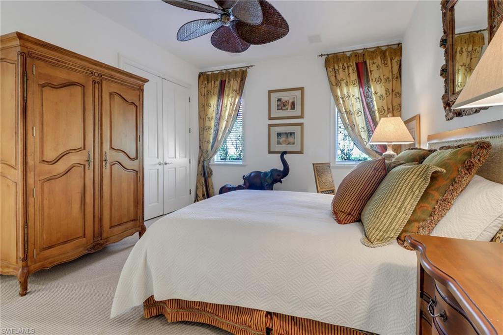 9376 Sweetgrass Way Naples, FL 34108 - Photo 36 of 49 a bedroom with a bed and a window