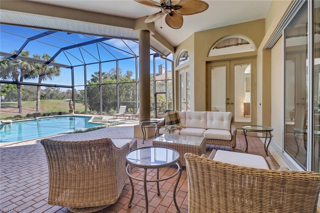 9376 Sweetgrass Way Naples, FL 34108 - Photo 40 of 49 a outdoor space with patio the couches and a potted plant