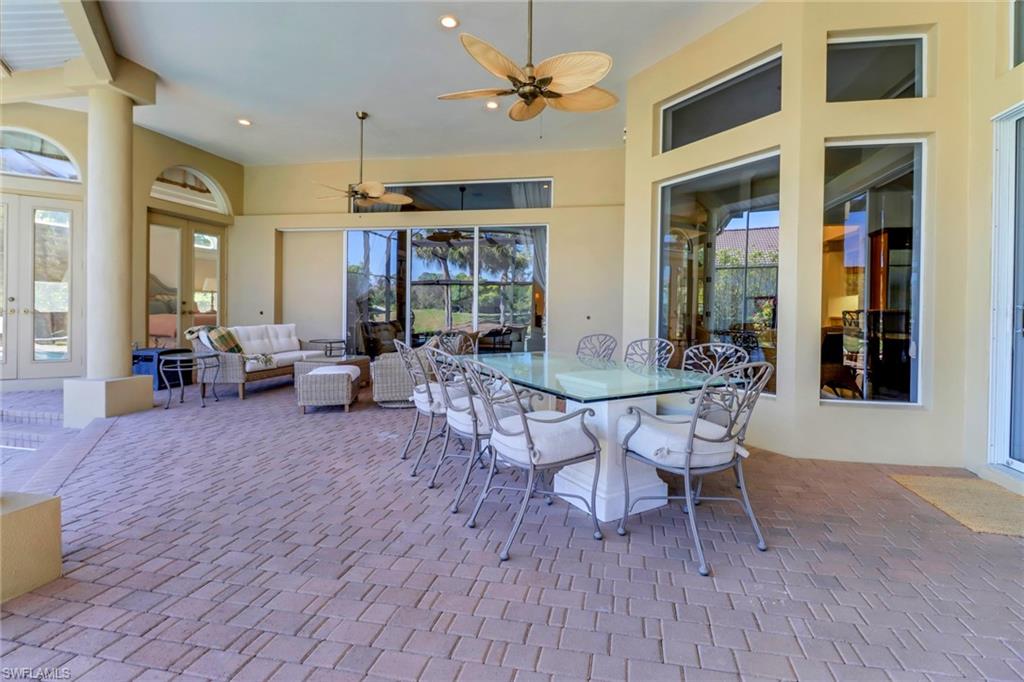 9376 Sweetgrass Way Naples, FL 34108 - Photo 42 of 49 a view of a livingroom with furniture window and wooden floor