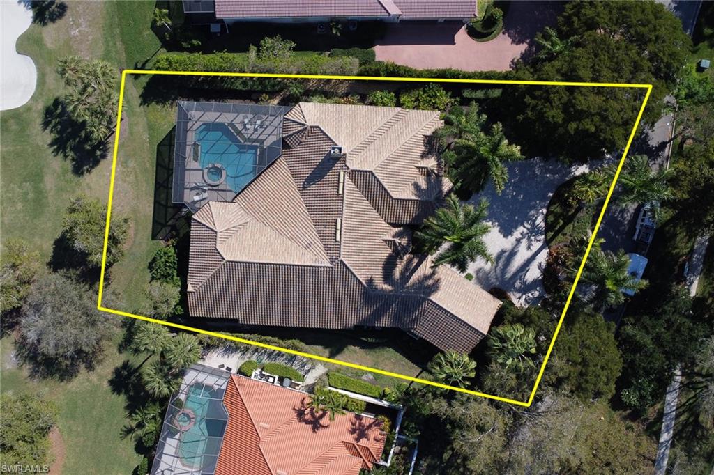 9376 Sweetgrass Way Naples, FL 34108 - Photo 49 of 49 an aerial view of a house with a yard and a fountain
