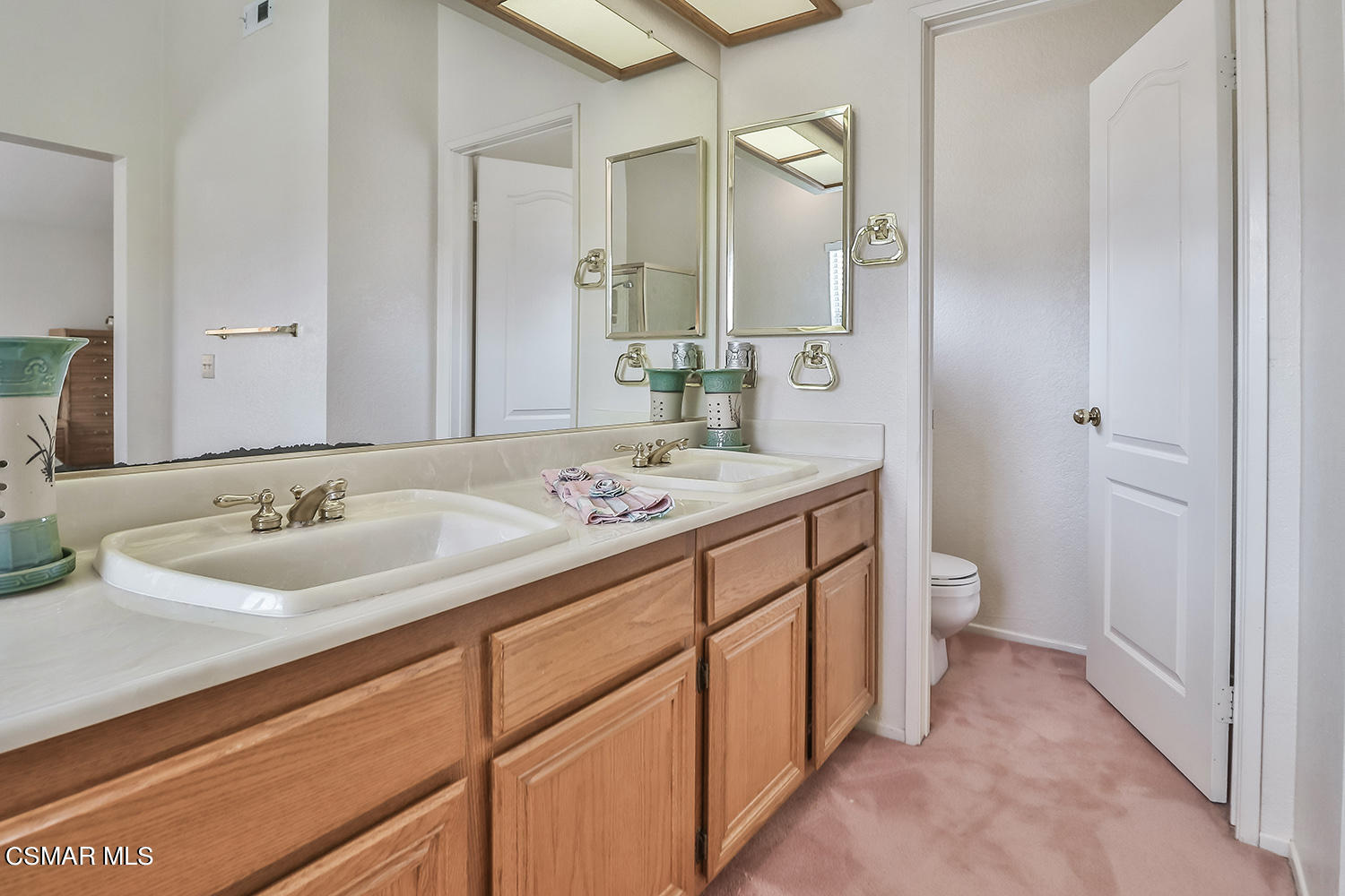 90 Valley Crest Road Simi Valley, CA 93065 - Photo 13 of 19 a bathroom with a sink and a mirror