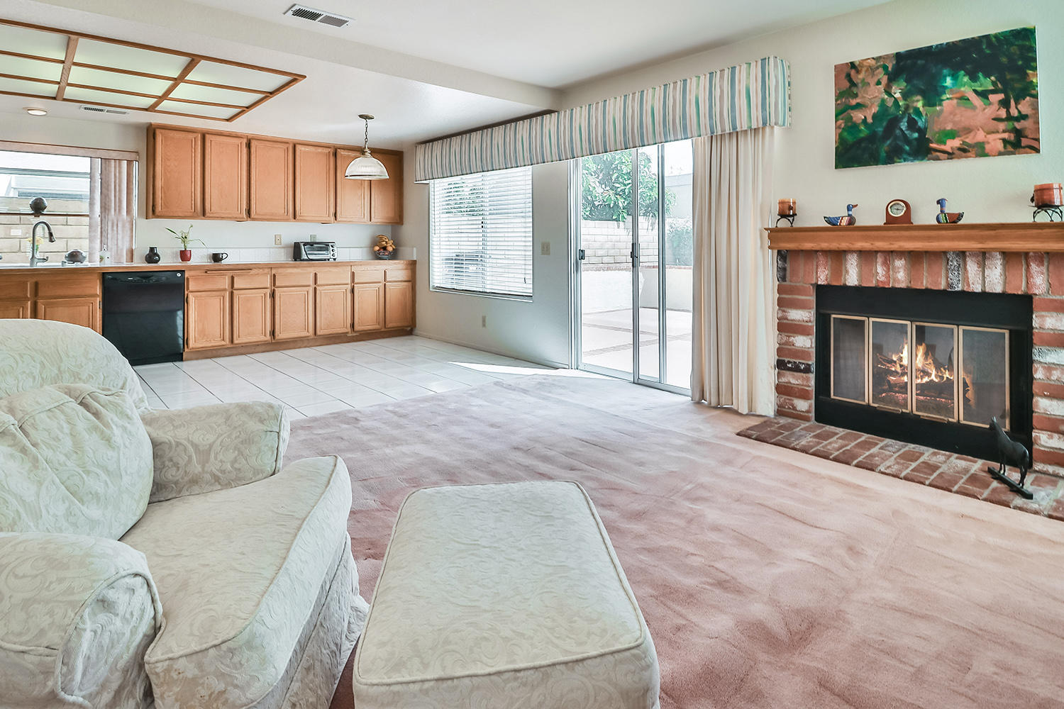 90 Valley Crest Road Simi Valley, CA 93065 - Photo 5 of 19 a living room with stainless steel appliances furniture a fireplace a flat screen tv and a window