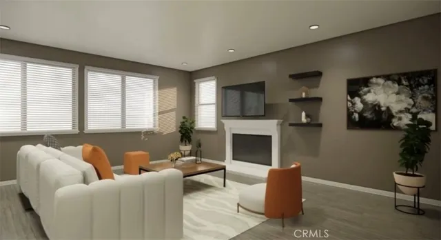 a living room with furniture flat screen tv and a fireplace