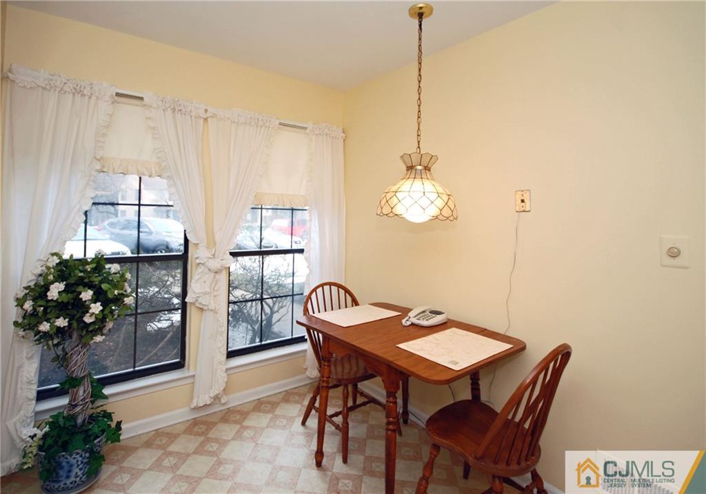 1803 Timber Oaks Road Edison, NJ 08820 - Photo 3 of 30 a view of a dining room with furniture and chandelier